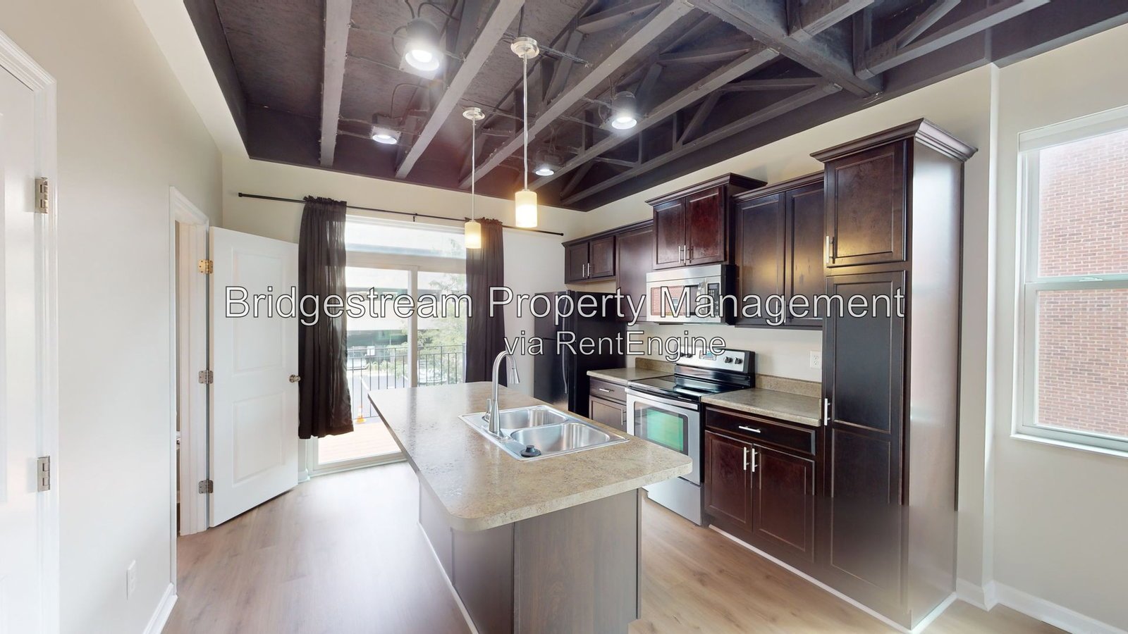 Beautiful 2 bedroom, 1.5 bath townhome with 1 car attached garage and reserved parking space in Downtown Dayton near Riverscape property image